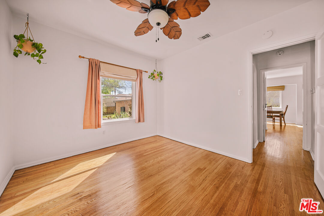 592 Figueroa Drive Altadena, CA 91001 - Photo 13 of 19 a view of an empty room with wooden floor and a window