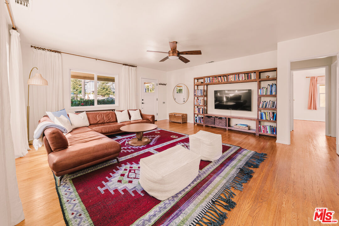 592 Figueroa Drive Altadena, CA 91001 - Photo 2 of 19 a living room with furniture and a flat screen tv
