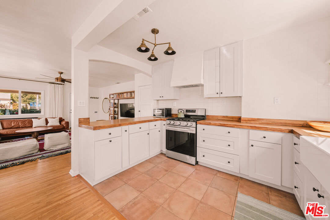 592 Figueroa Drive Altadena, CA 91001 - Photo 5 of 19 a kitchen with cabinets oven and a dishwasher