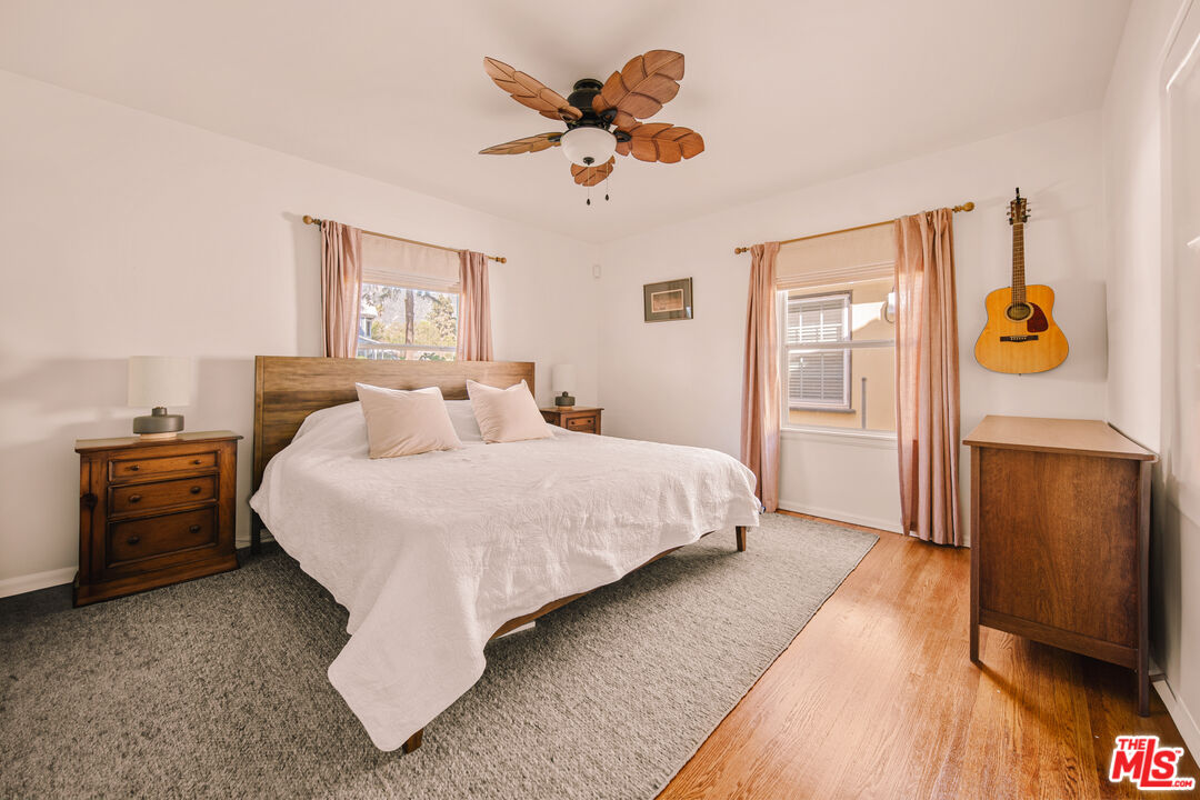 592 Figueroa Drive Altadena, CA 91001 - Photo 10 of 19 a bedroom with a bed and a chandelier