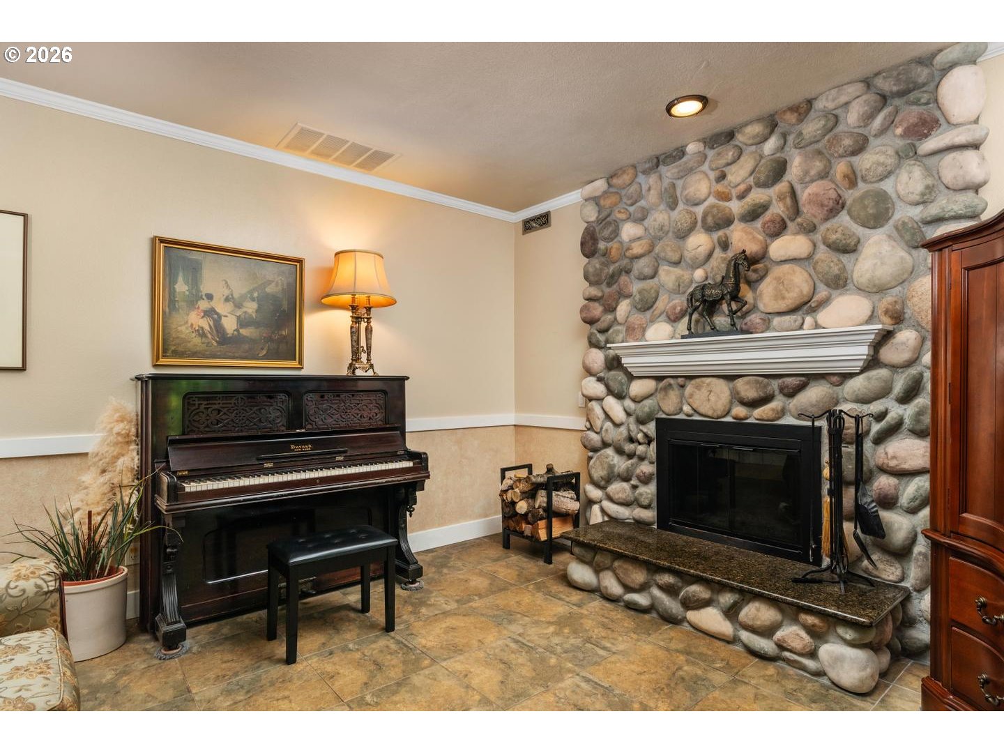 16042 Southwest Waxwing Way Beaverton, OR 97007 - Photo 14 of 48 a living room with a fireplace and a piano