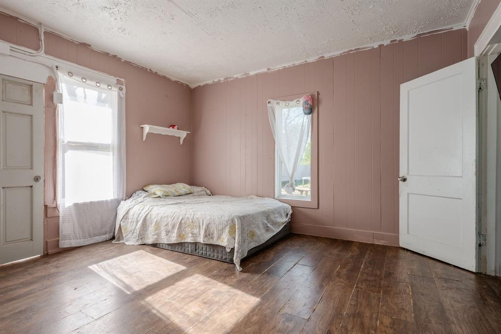 514 Pierce Street Denton, TX 76201 - Photo 11 of 18 a bedroom with a bed and a window