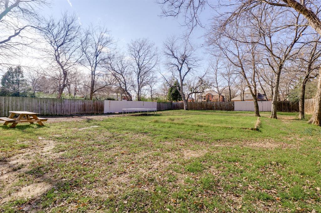 514 Pierce Street Denton, TX 76201 - Photo 16 of 18 a backyard of a house with lots of green space