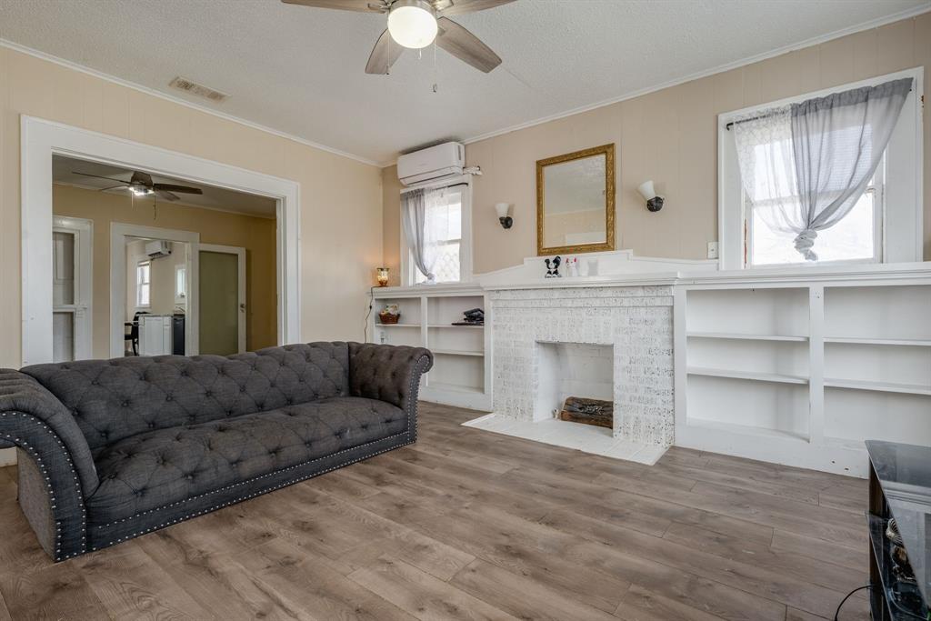 514 Pierce Street Denton, TX 76201 - Photo 4 of 18 a living room with furniture and a fireplace