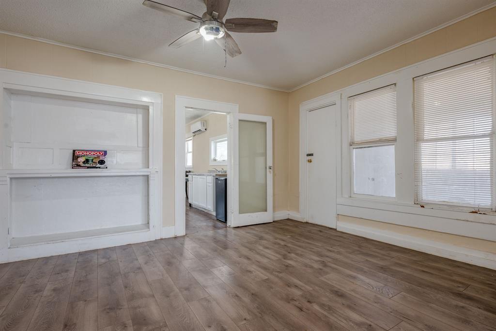514 Pierce Street Denton, TX 76201 - Photo 10 of 18 wooden floor in an empty room with a window
