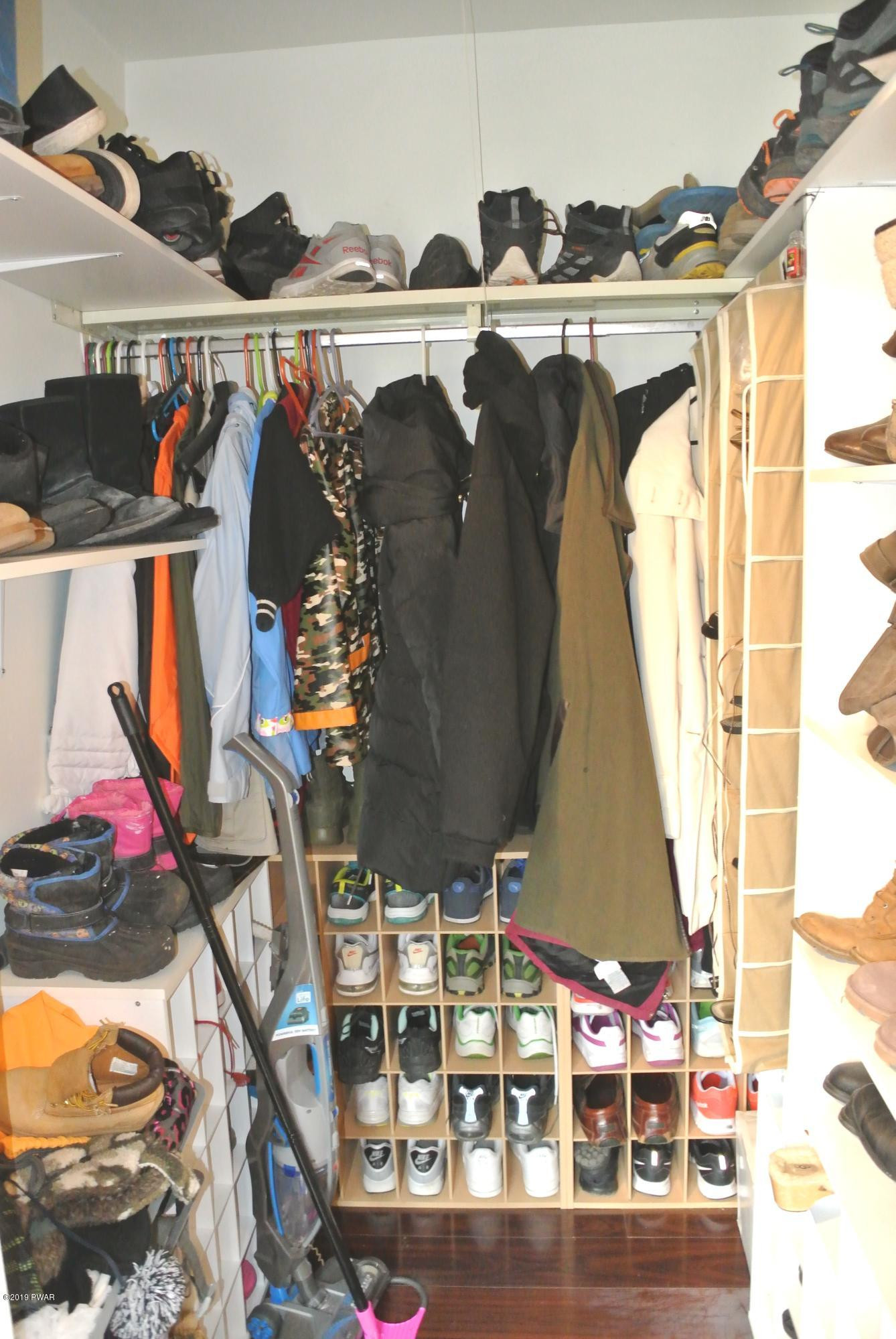 113 Fern Road Dingmans Ferry, PA 18328 - Photo 12 of 20 a view of walk in closet with clothes and shoes