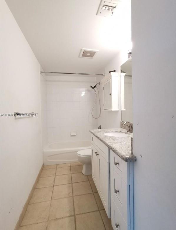 1250 South Miami Avenue, Unit 2104 Miami, FL 33130 - Photo 11 of 18 a bathroom with a granite countertop sink a toilet and shower