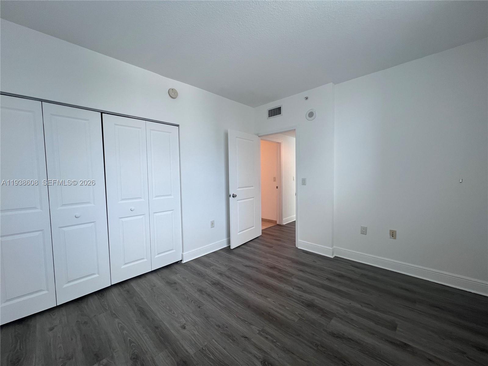 1250 South Miami Avenue, Unit 2104 Miami, FL 33130 - Photo 18 of 18 a view of an empty room with wooden floor