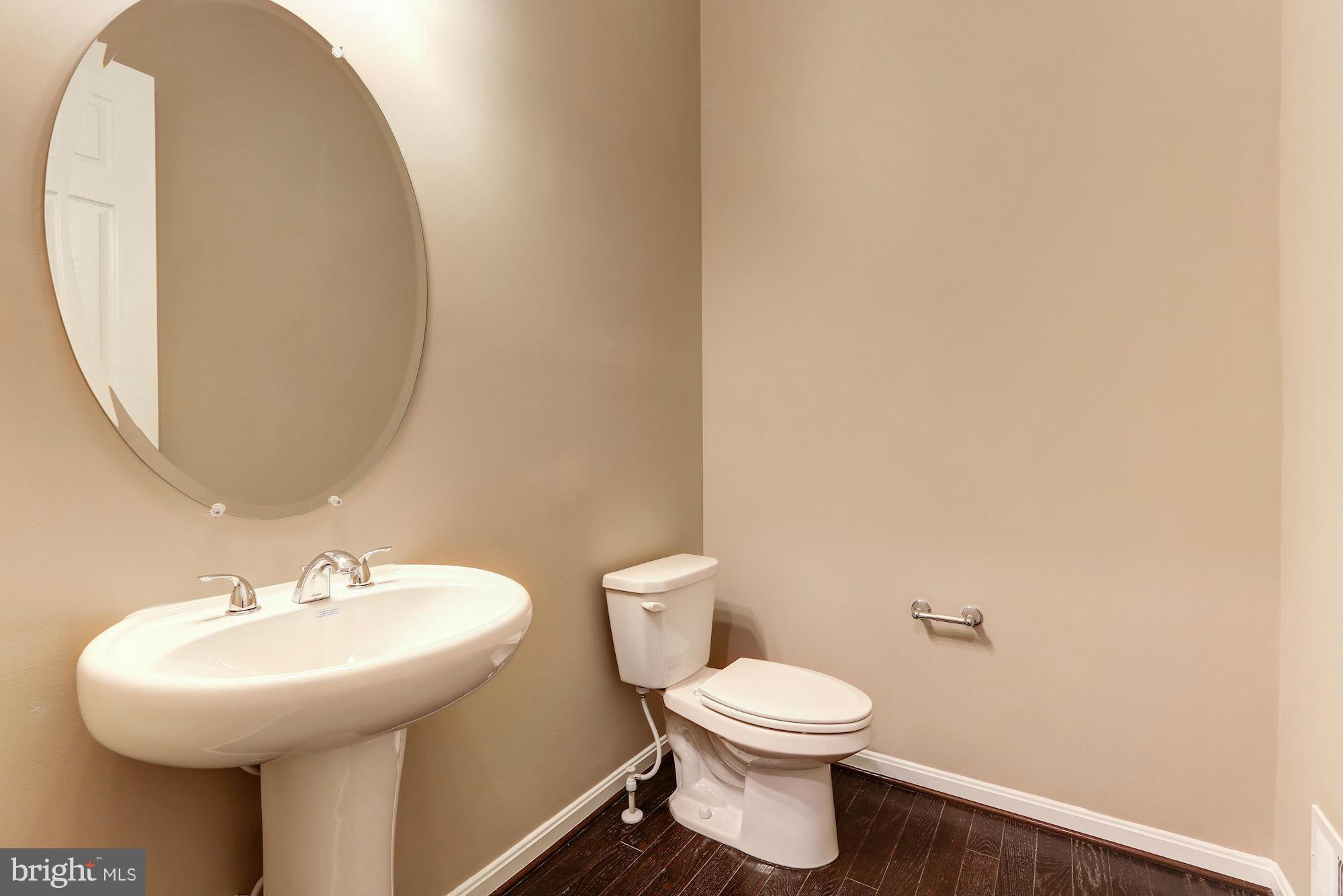 925 Lindley Road Frederick, MD 21701 - Photo 16 of 30 a bathroom with a sink and a mirror