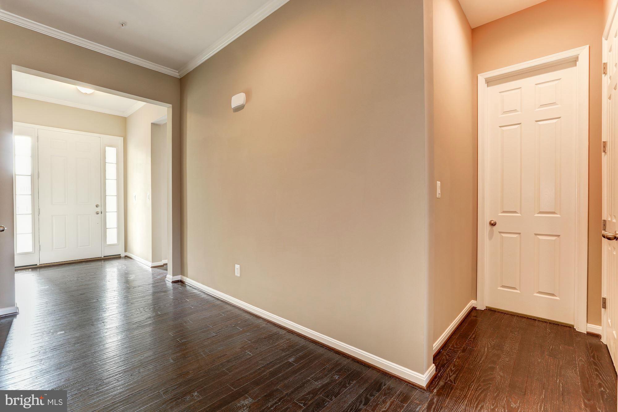 925 Lindley Road Frederick, MD 21701 - Photo 6 of 30 a view of an empty room with wooden floor