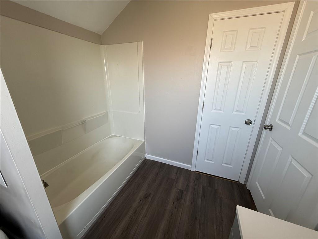 1056 Adams Street New Castle, PA 16101 - Photo 8 of 10 a bathroom with a bathtub