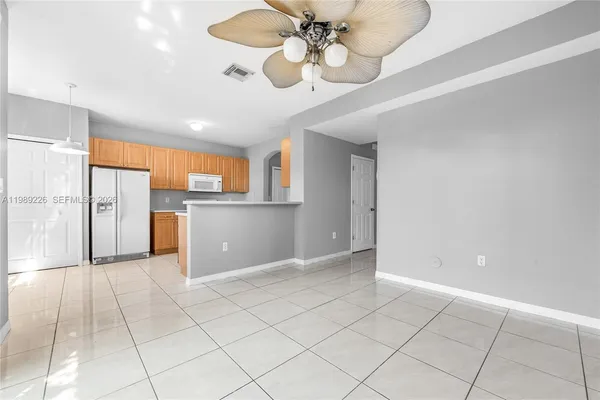 a view of a kitchen with a sink and cabinets