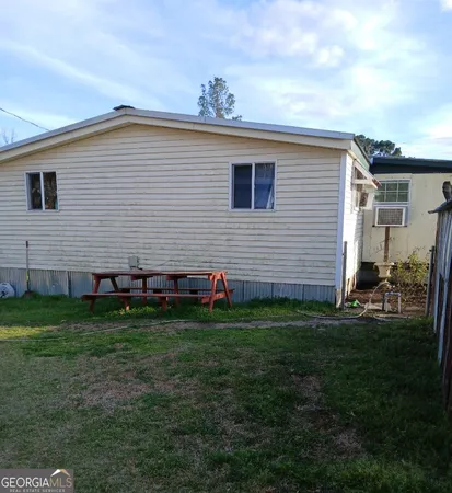a view of a backyard of the house