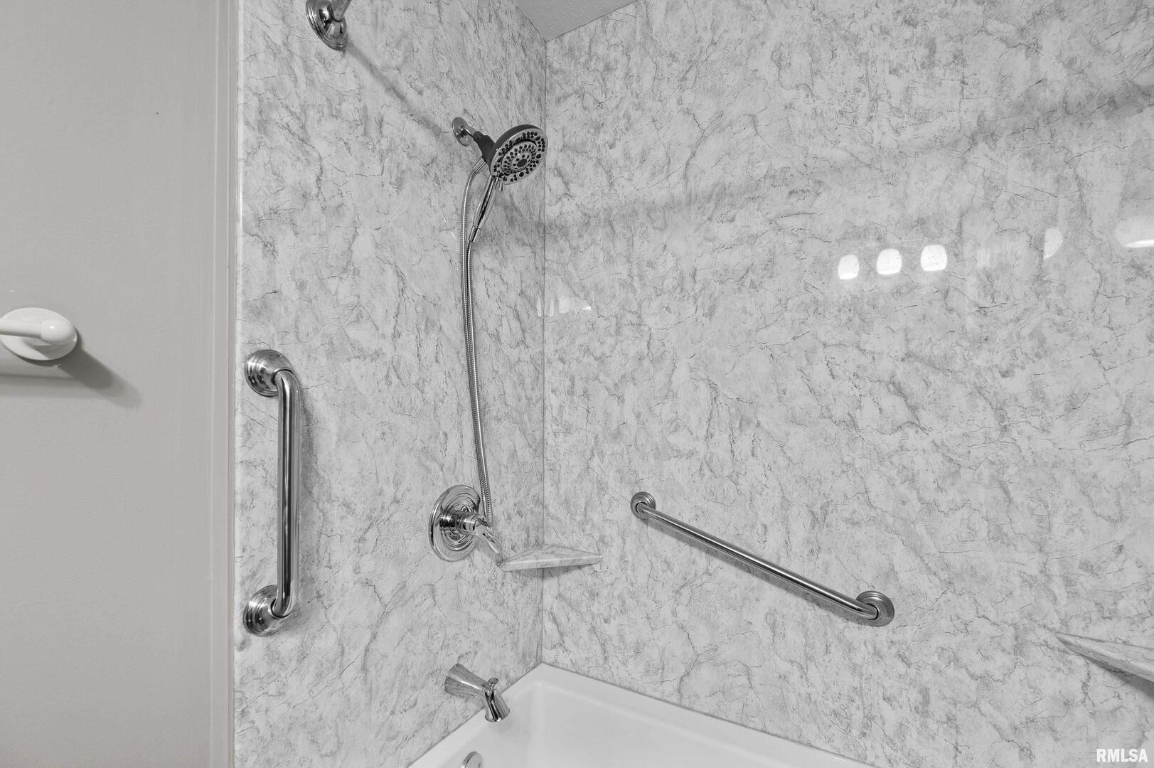 916 Ash Drive Colona, IL 61241 - Photo 14 of 38 a bathroom with a shower