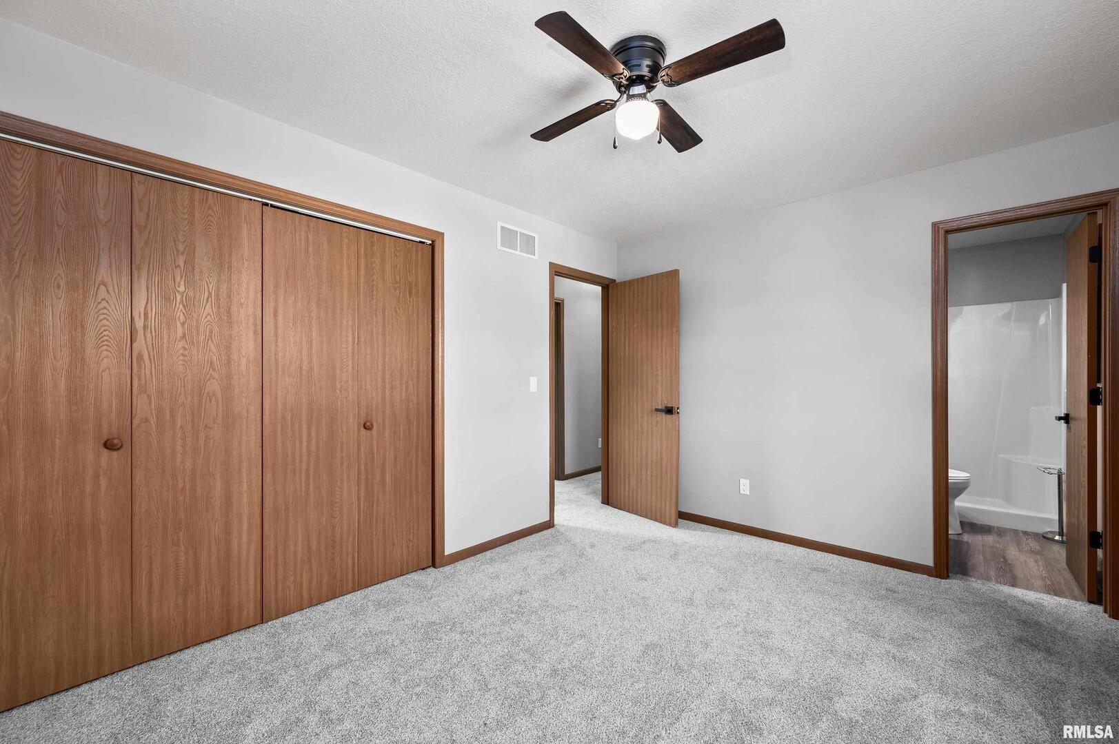 916 Ash Drive Colona, IL 61241 - Photo 20 of 38 a view of a big room with wooden floor in closet