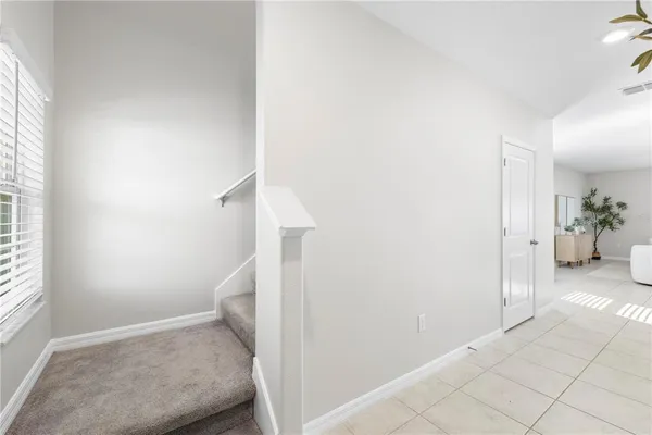 a bathroom with a granite countertop sink double and mirror