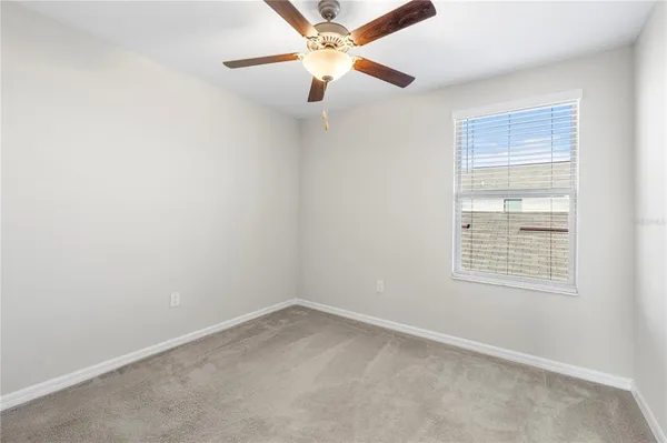 a house view with swimming pool in front of it