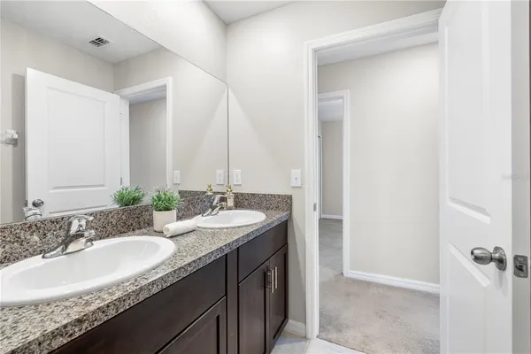 an aerial view of a house with a ocean view