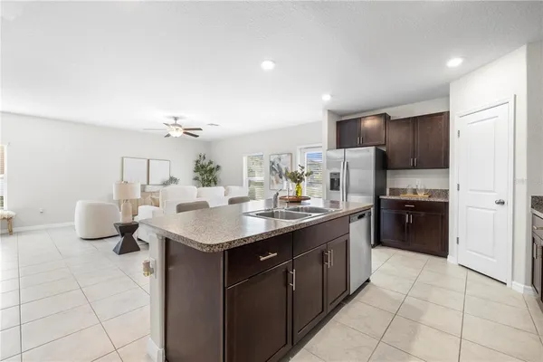 a view of an empty room with a ceiling fan