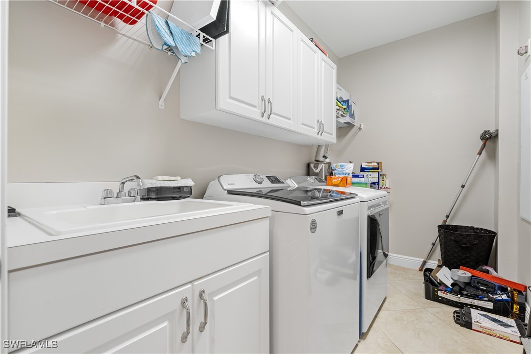 2090 West First Street, Unit I2409 Fort Myers, FL 33901 - Photo 24 of 50 a utility room with dryer and washer