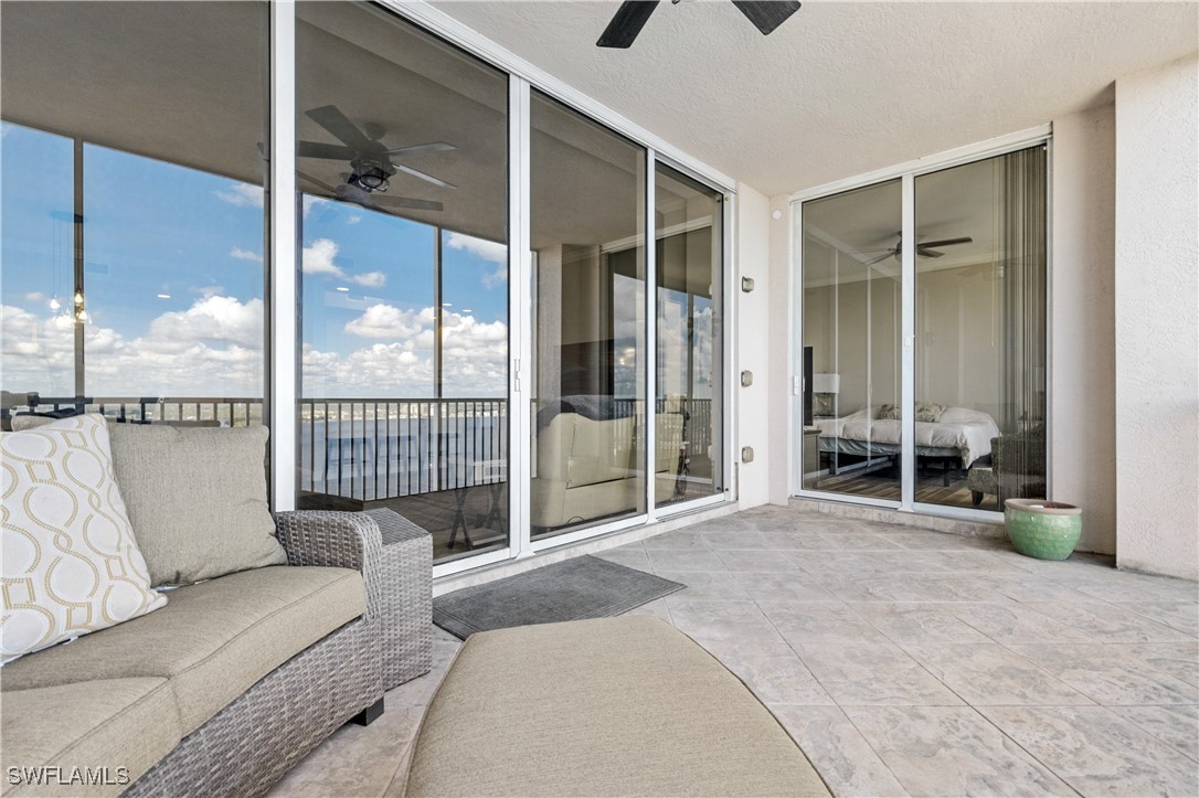 2090 West First Street, Unit I2409 Fort Myers, FL 33901 - Photo 27 of 50 a spacious bedroom with a large bed and a large window