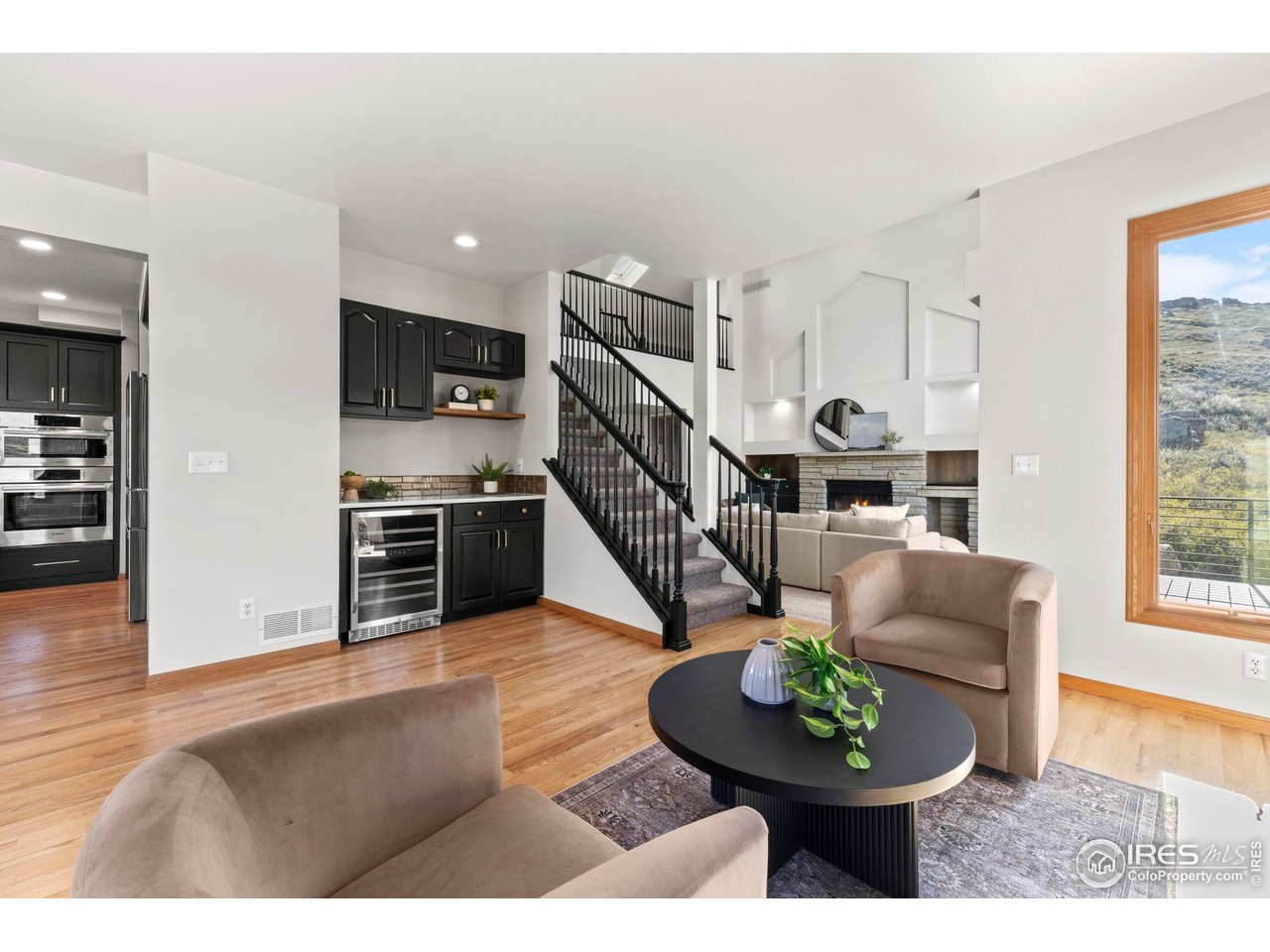 6534 Gindler Ranch Road Fort Collins, CO 80526 - Photo 19 of 48 Hearth Room Adjacent to Kitchen and Informal Dining