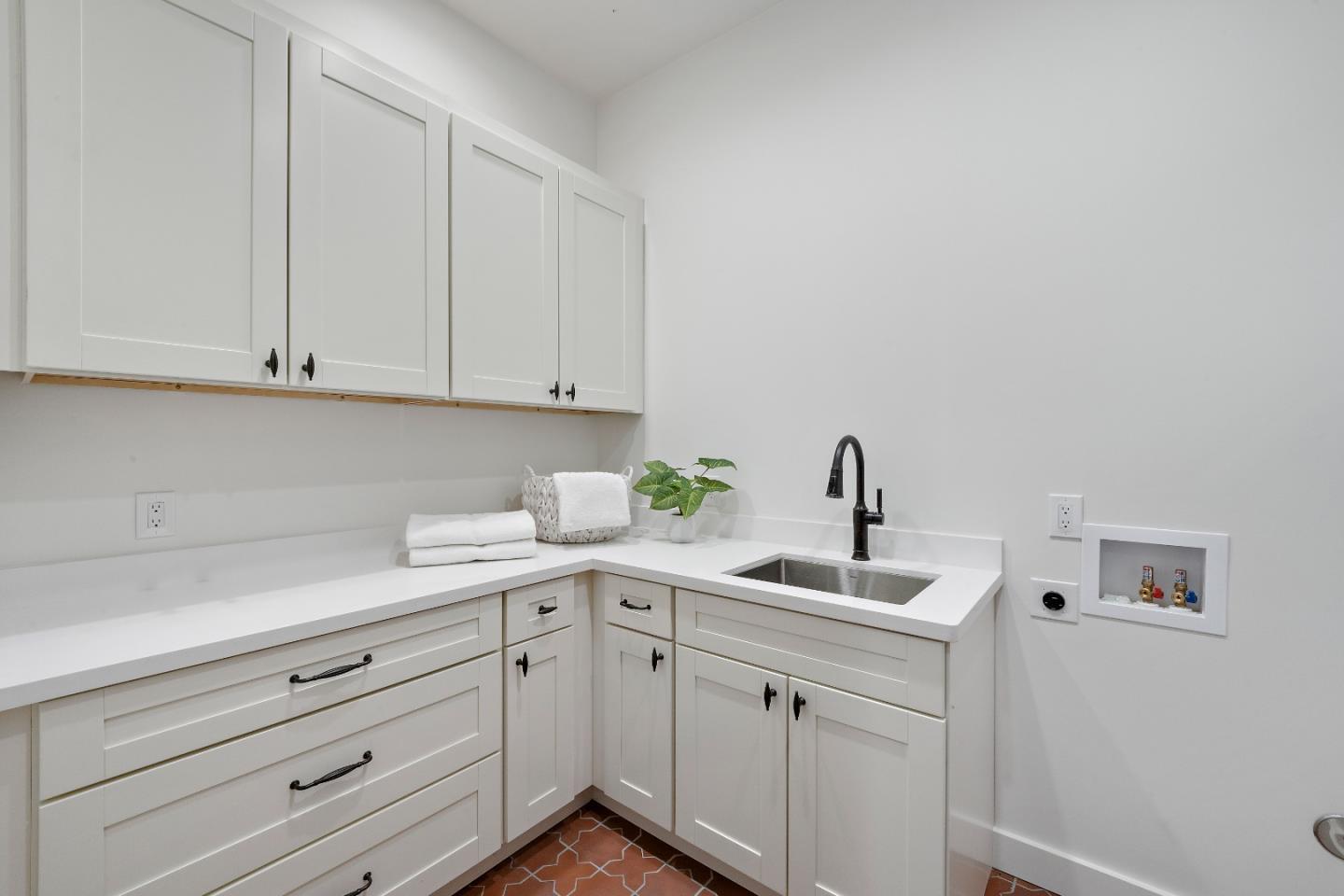 15269 Bohlman Road Saratoga, CA 95070 - Photo 13 of 68 a kitchen with white cabinets and a sink