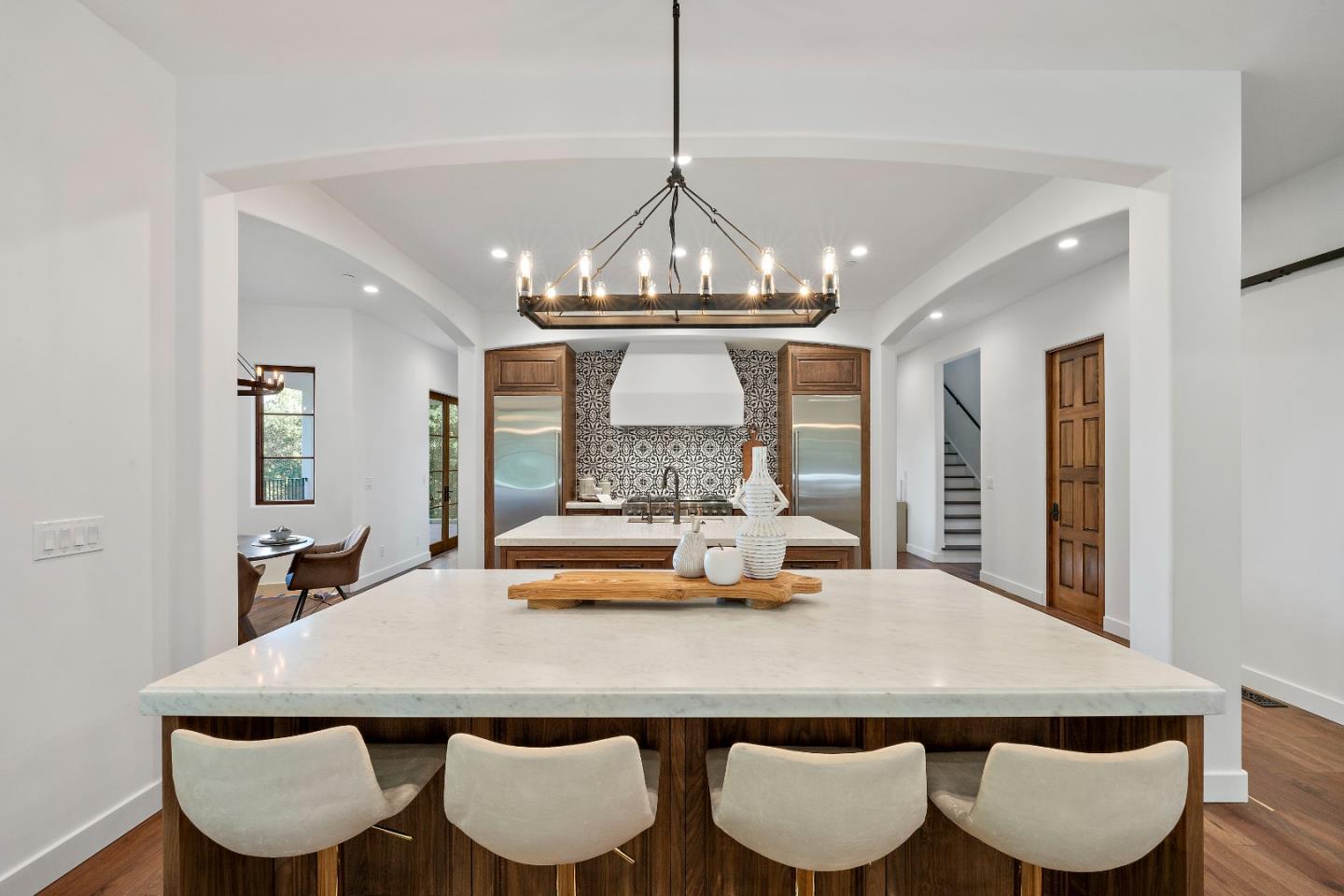 15269 Bohlman Road Saratoga, CA 95070 - Photo 23 of 68 a view of a dining room with furniture and wooden floor