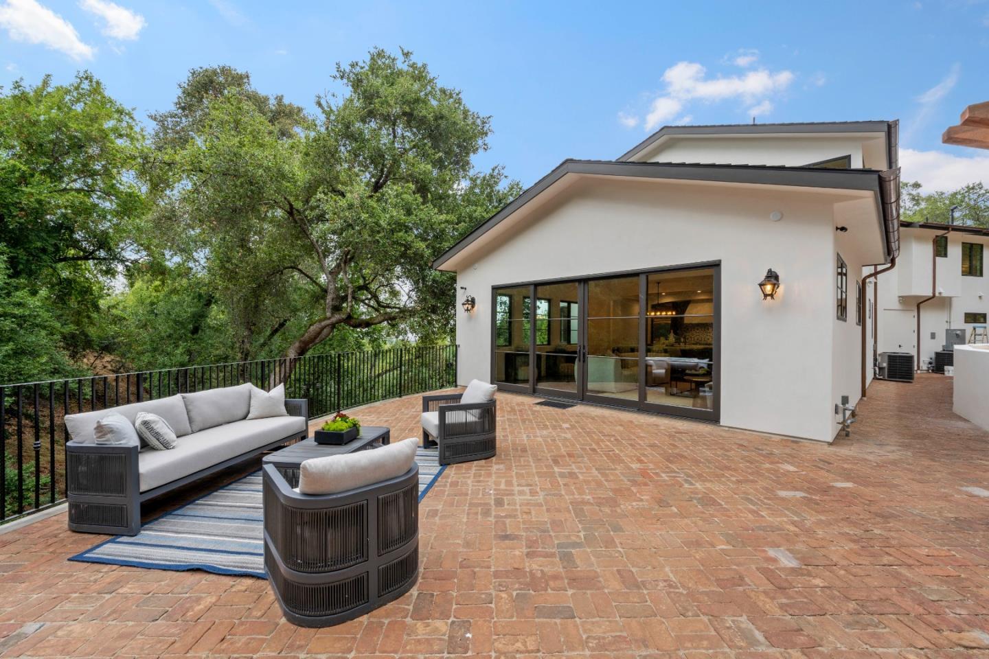 15269 Bohlman Road Saratoga, CA 95070 - Photo 28 of 68 a view of a patio with couches table and chairs and potted plants