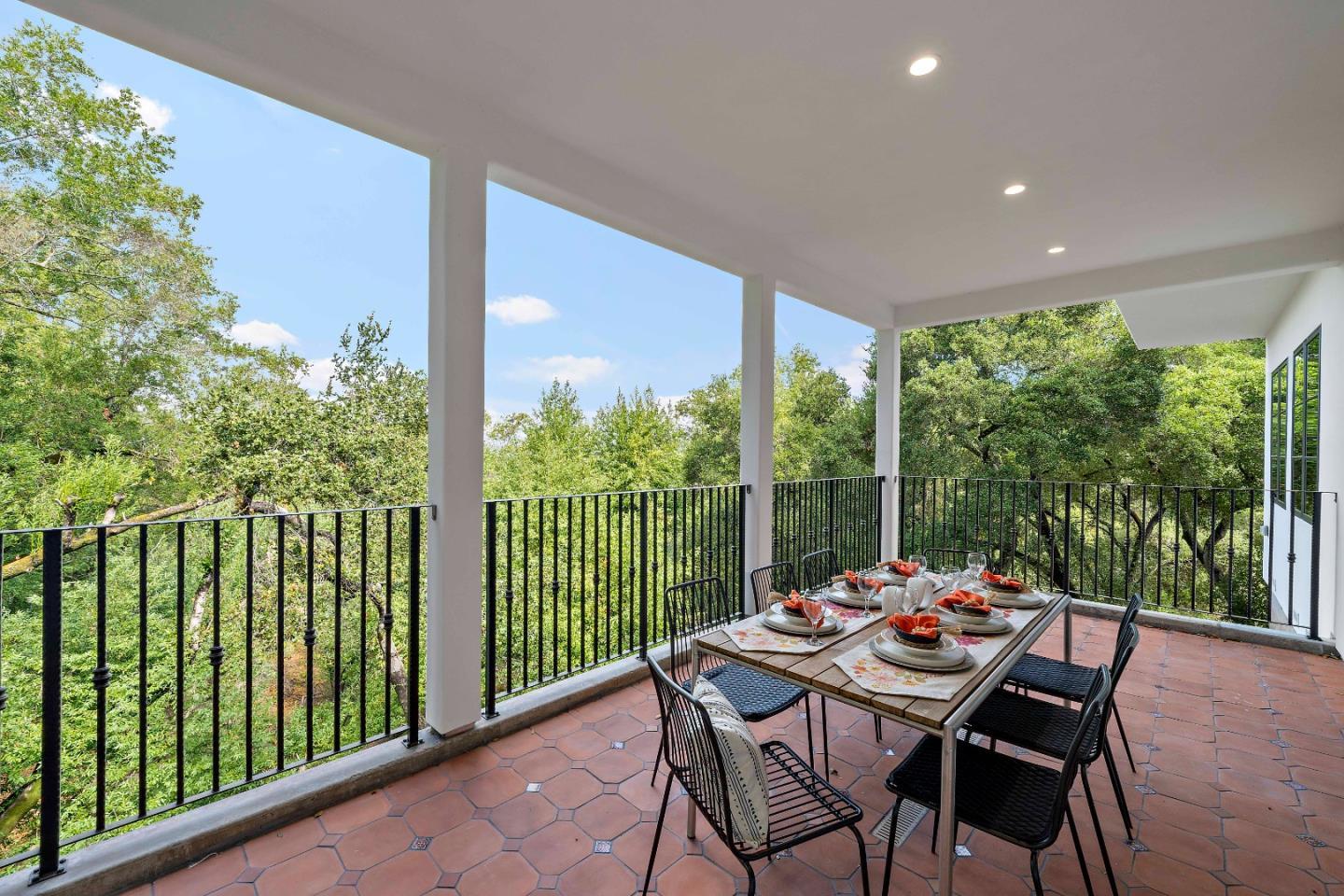 15269 Bohlman Road Saratoga, CA 95070 - Photo 30 of 68 a view of a patio with a table chairs and a table