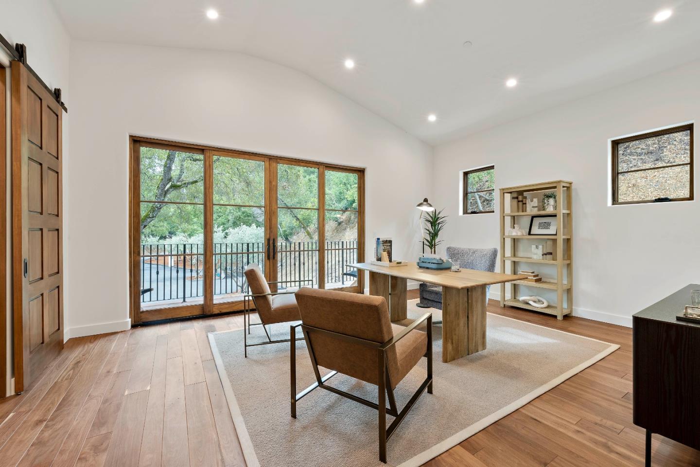 15269 Bohlman Road Saratoga, CA 95070 - Photo 33 of 68 a living room with furniture a large window and wooden floor