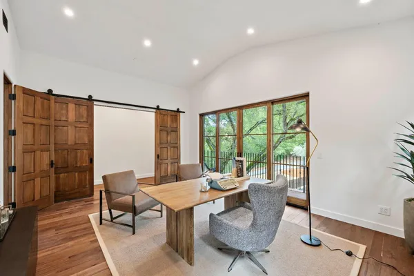 a bedroom with a bed and a table