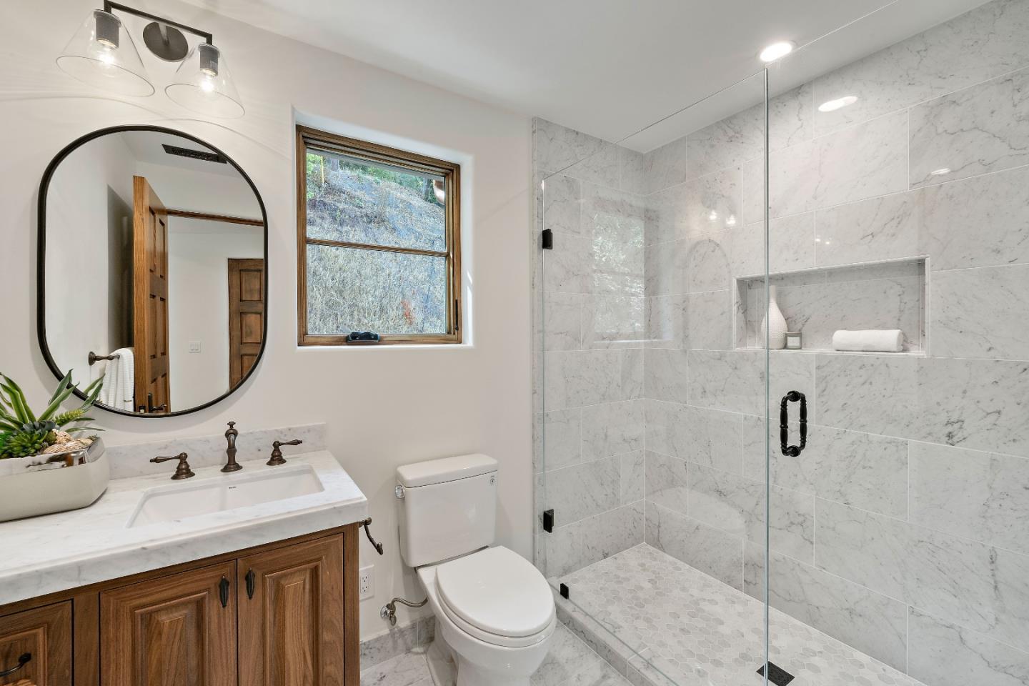 15269 Bohlman Road Saratoga, CA 95070 - Photo 40 of 68 a bathroom with a sink toilet and shower