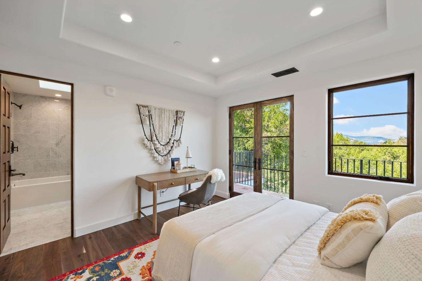 15269 Bohlman Road Saratoga, CA 95070 - Photo 43 of 68 a bedroom with a bed and a table