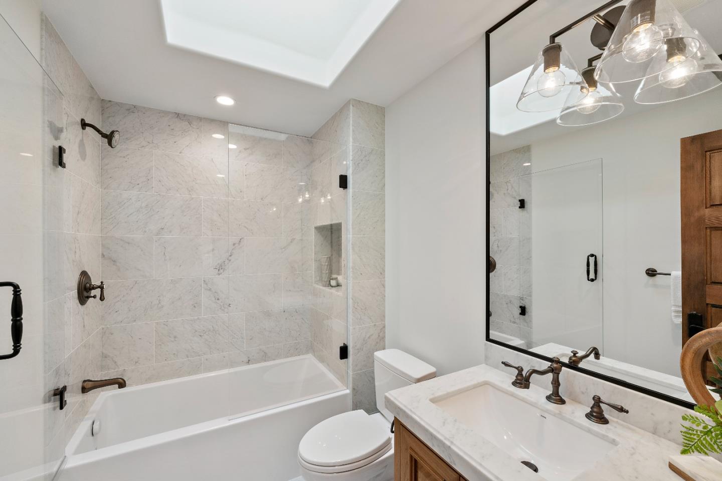 15269 Bohlman Road Saratoga, CA 95070 - Photo 45 of 68 a bathroom with a sink toilet and shower