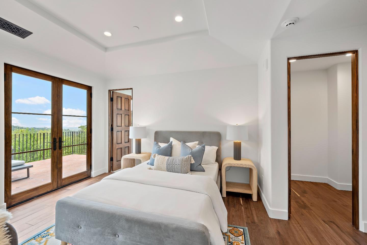 15269 Bohlman Road Saratoga, CA 95070 - Photo 47 of 68 a bedroom with a bed and a large window