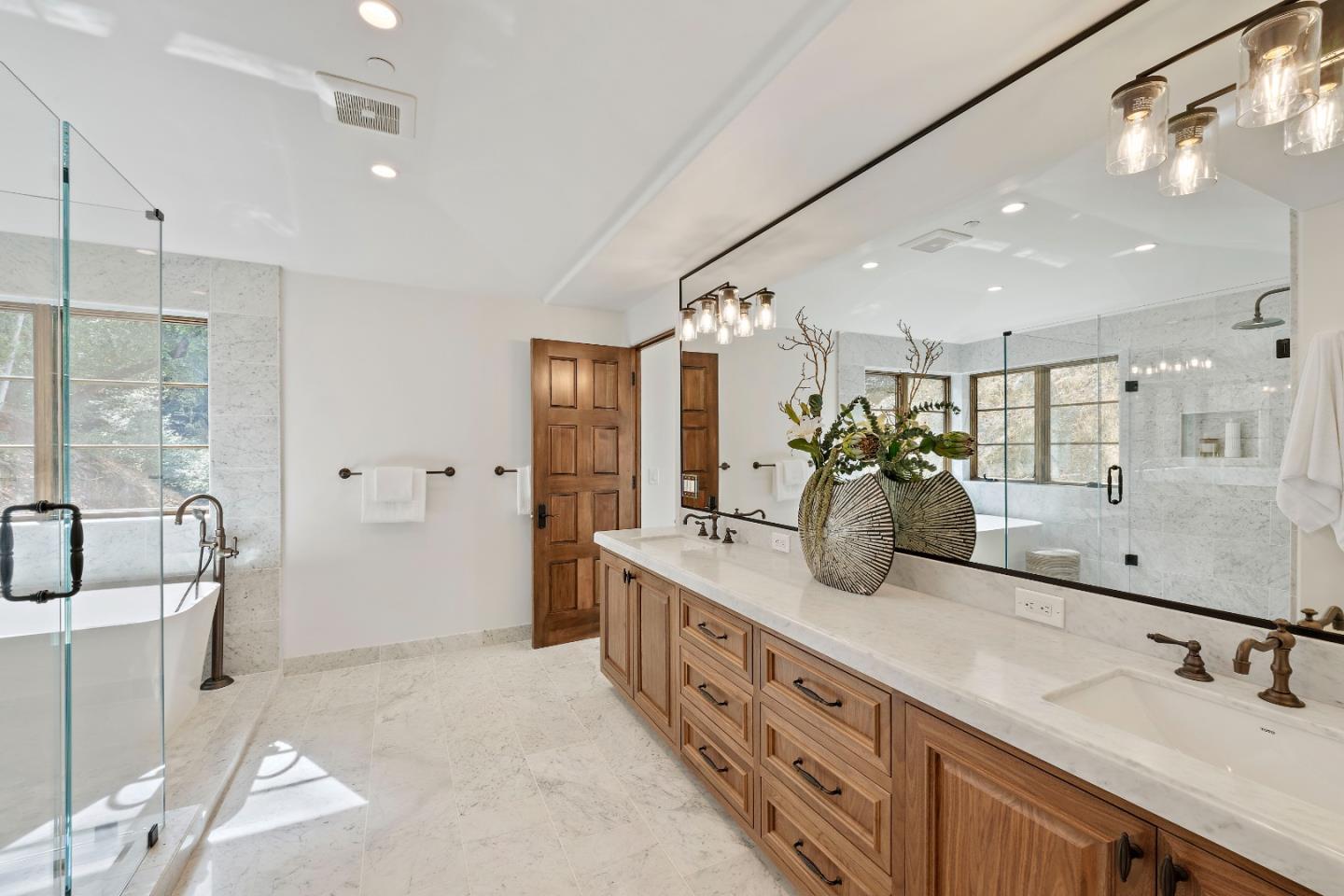 15269 Bohlman Road Saratoga, CA 95070 - Photo 51 of 68 a bathroom with double vanity and a mirror
