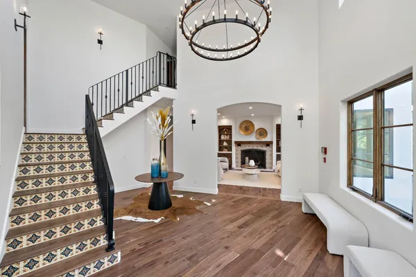 a view of an entryway with wooden floor and windows