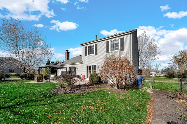 a front view of house with a garden