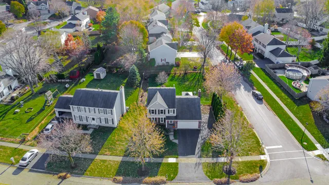 an aerial view of residential houses with outdoor space