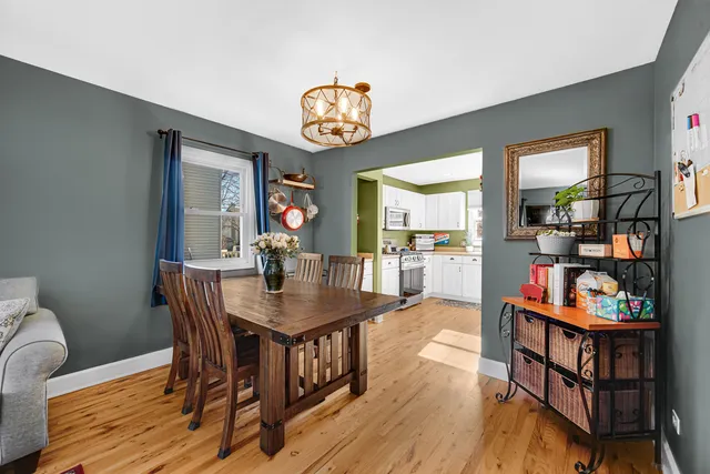 a view of a dining room with furniture and a book shelf
