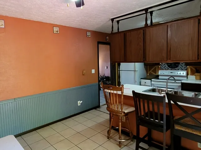 a view of a workspace with furniture