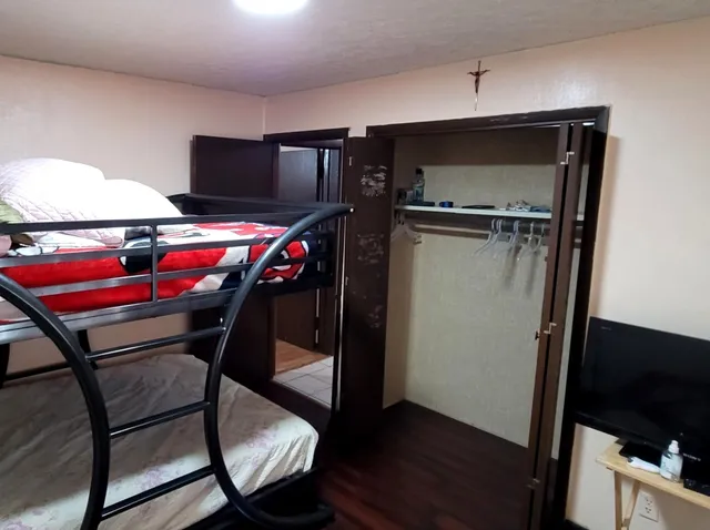 a view of a patio with table and chairs