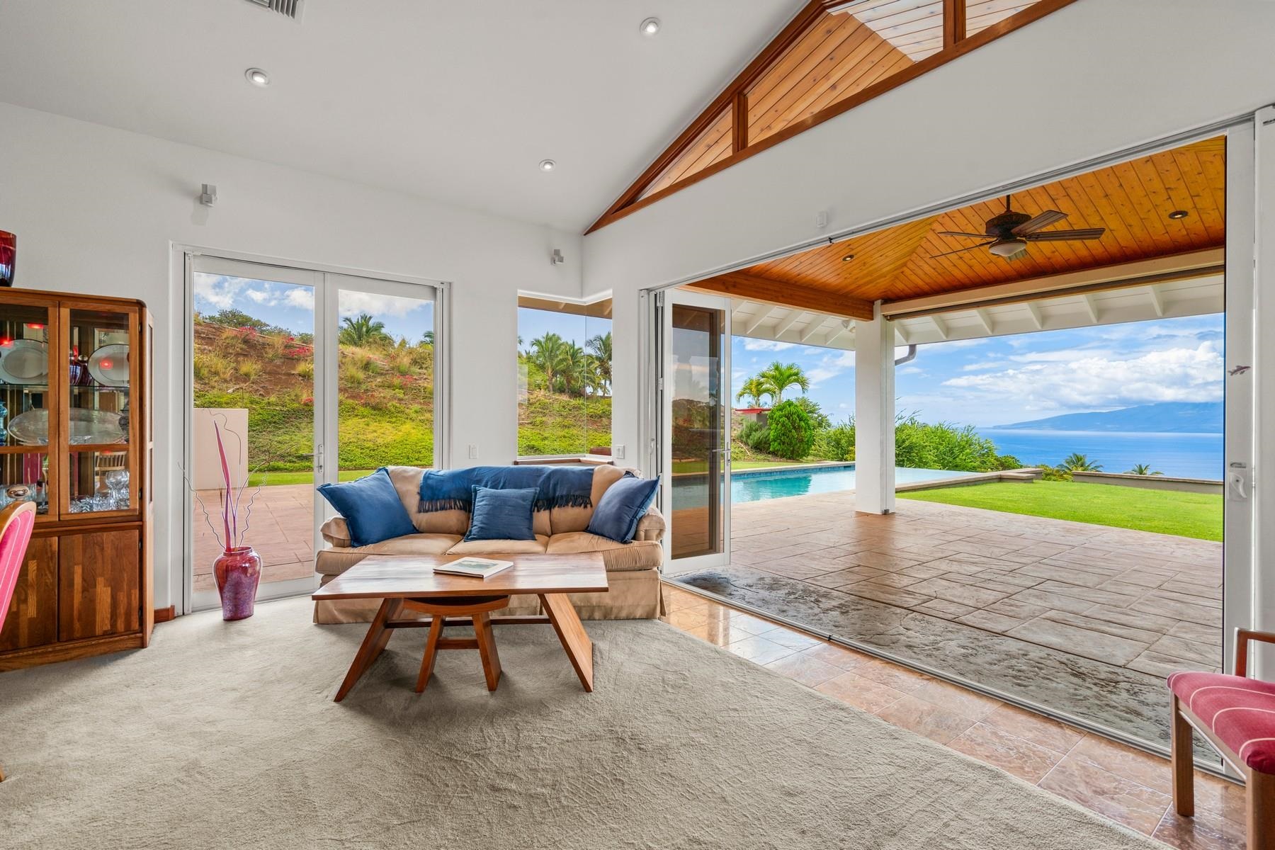 70 Iliahi Way Lahaina, HI 96761 - Photo 21 of 50 a living room with furniture and a floor to ceiling window
