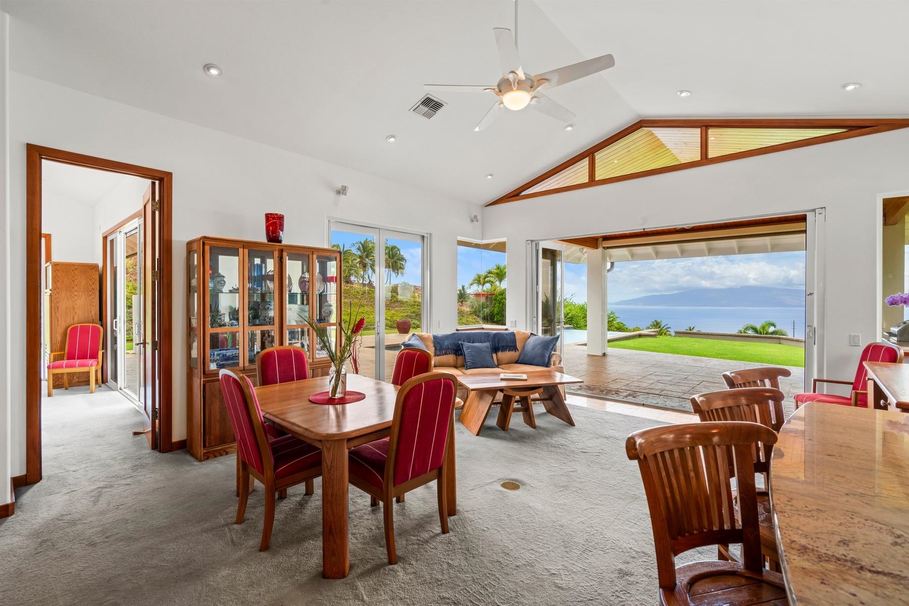 70 Iliahi Way Lahaina, HI 96761 - Photo 22 of 50 a view of a dining room with furniture chandelier and a wooden floor