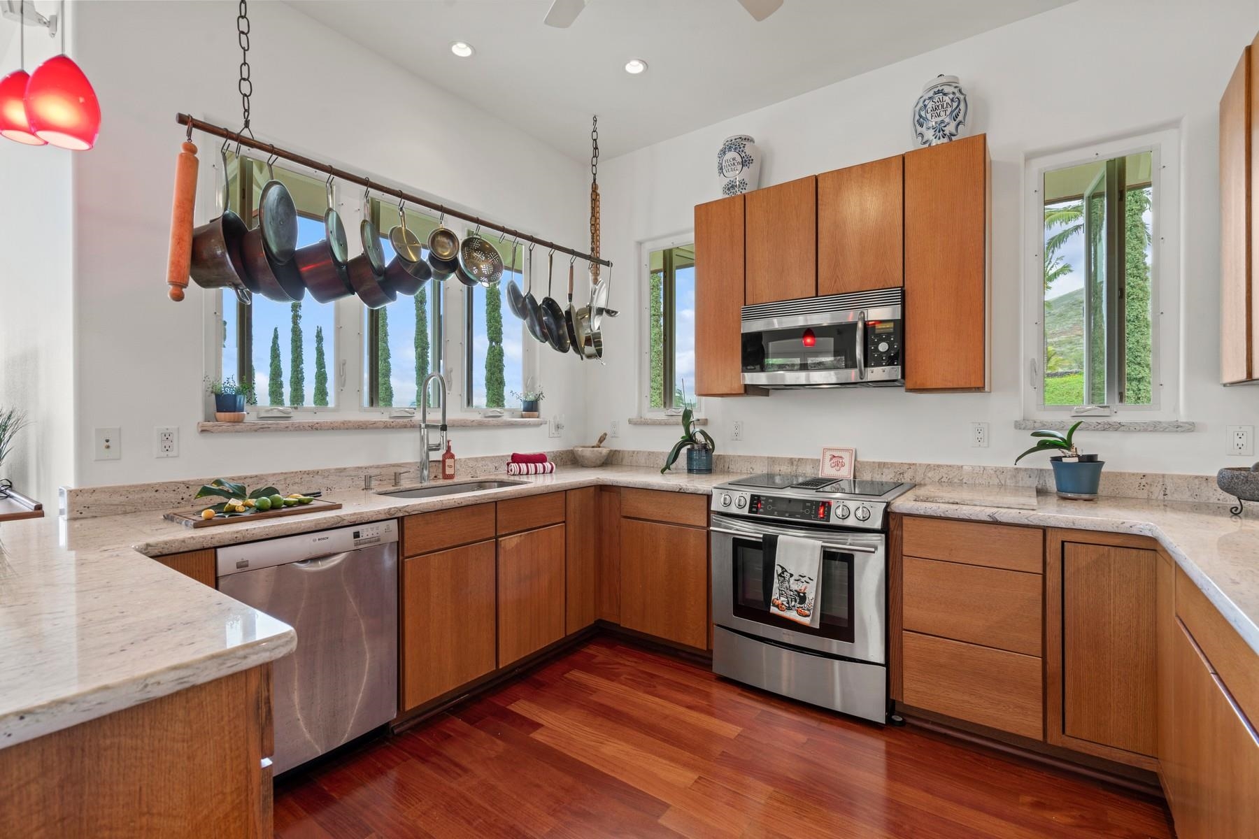 70 Iliahi Way Lahaina, HI 96761 - Photo 28 of 50 a kitchen with stainless steel appliances granite countertop a sink stove and refrigerator