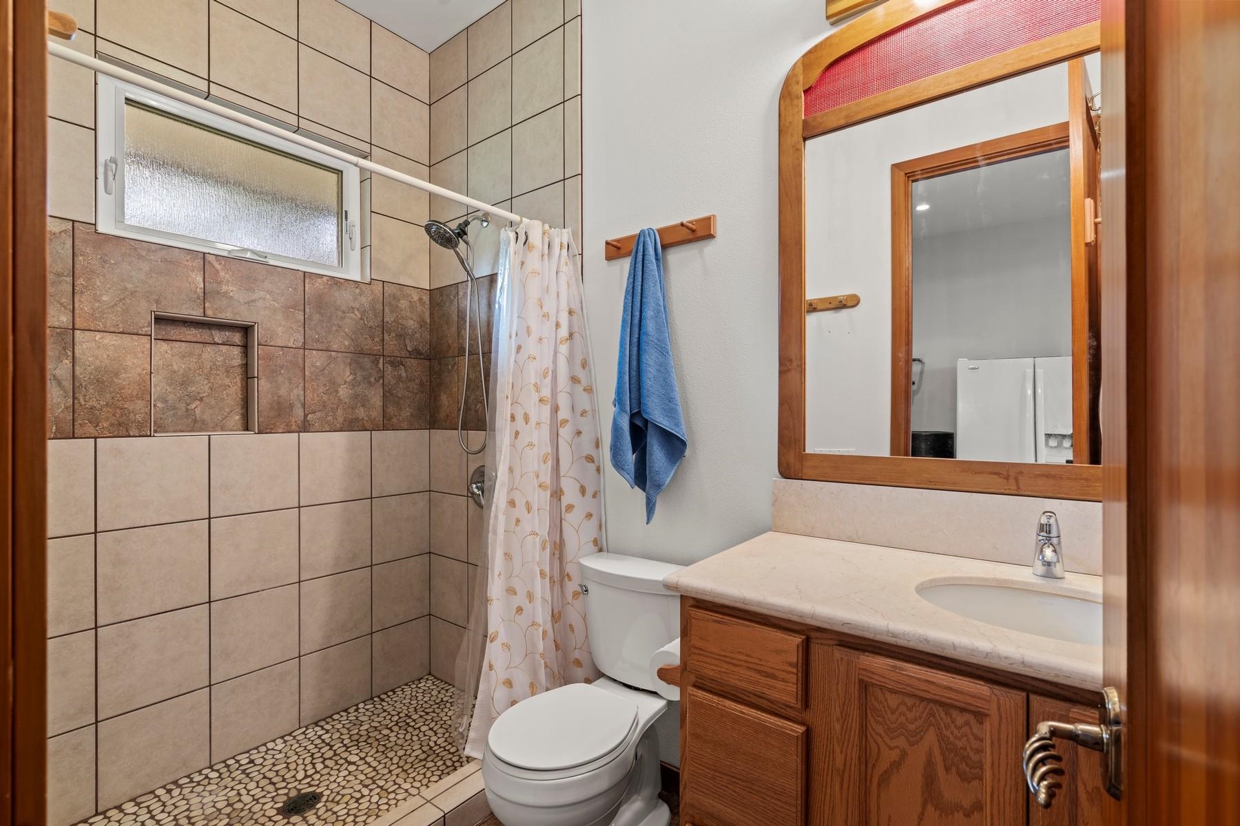 70 Iliahi Way Lahaina, HI 96761 - Photo 49 of 50 a bathroom with a sink toilet and shower