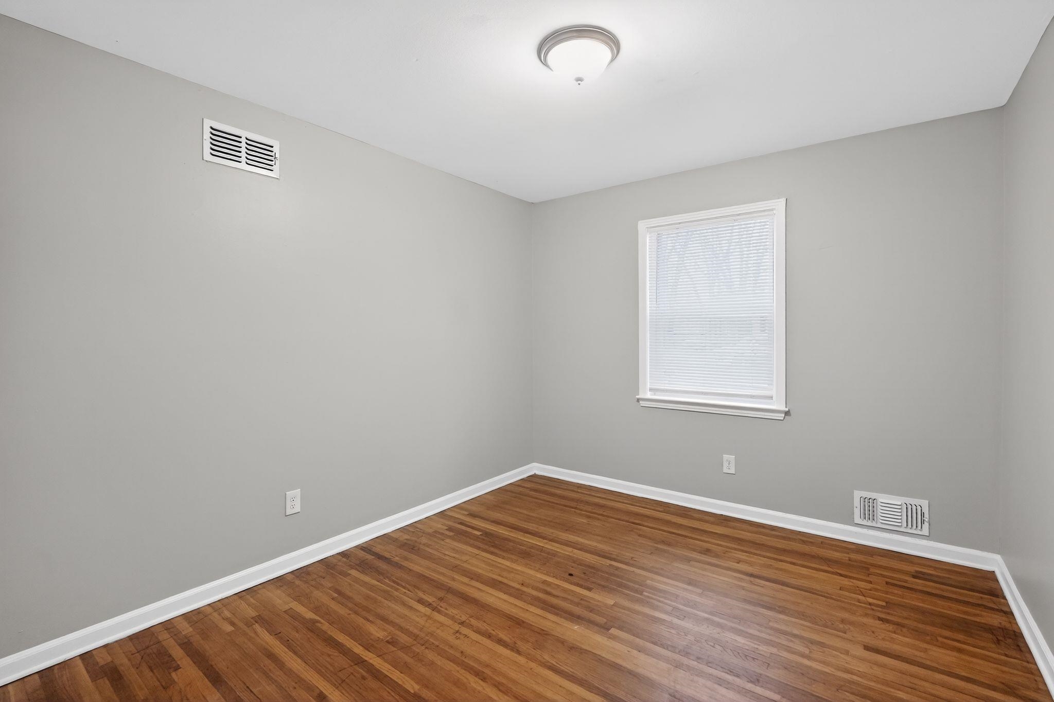 3150 Parham Street Memphis, TN 38127 - Photo 14 of 33 a view of a room with wooden floor and windows