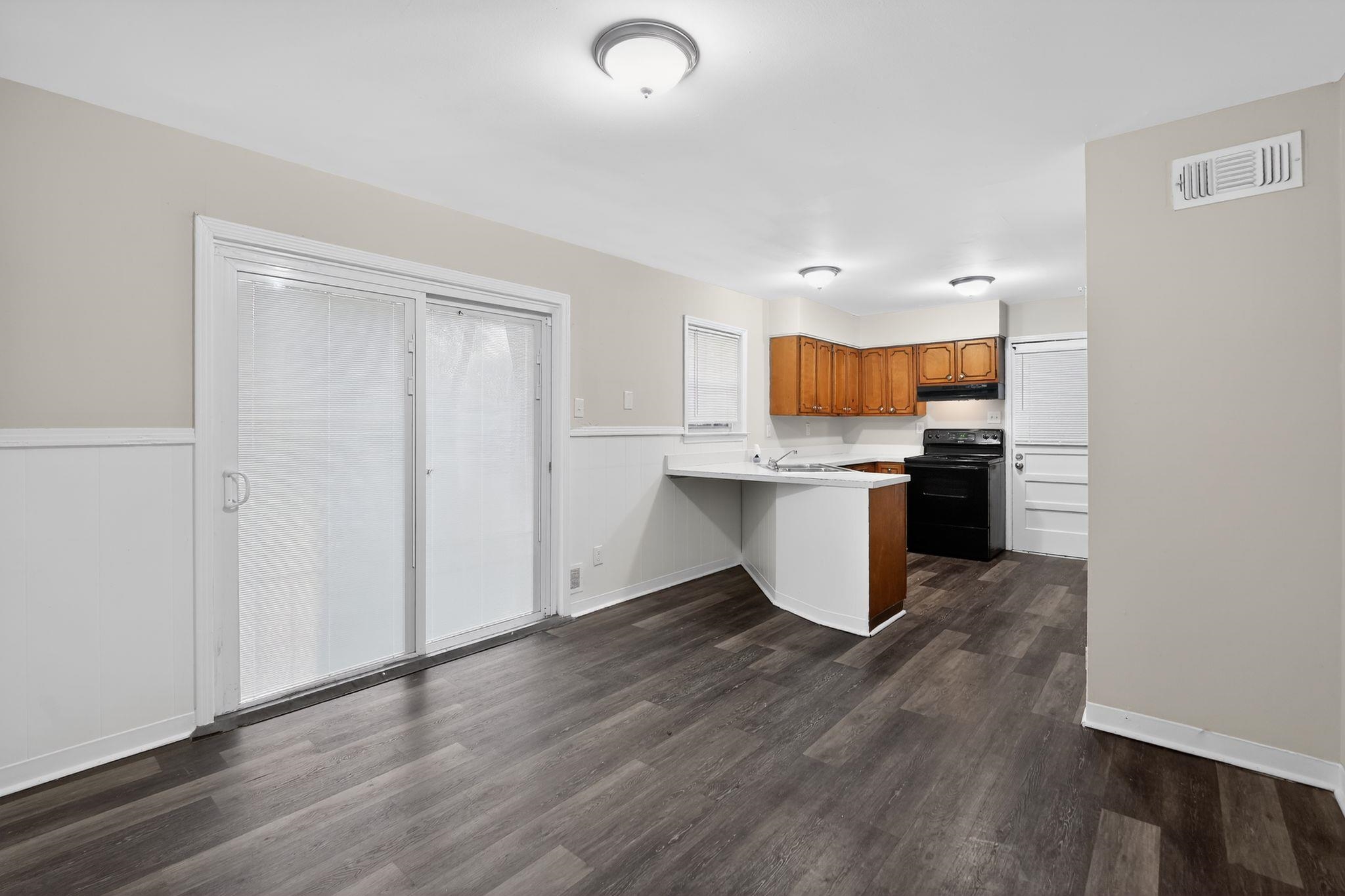 3150 Parham Street Memphis, TN 38127 - Photo 21 of 33 a kitchen with stainless steel appliances granite countertop a stove top oven a sink and a refrigerator