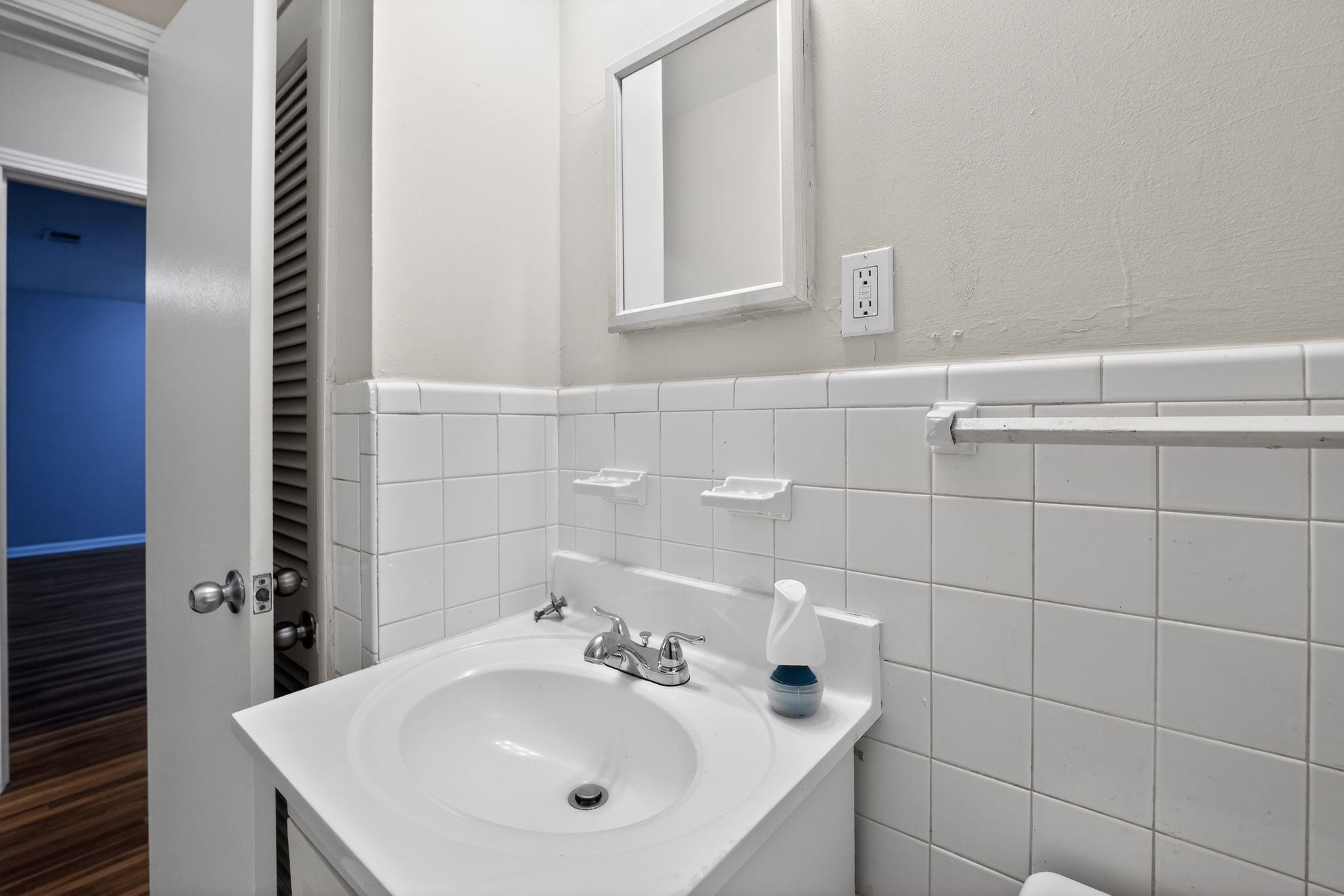 3150 Parham Street Memphis, TN 38127 - Photo 31 of 33 a bathroom with a sink and a mirror